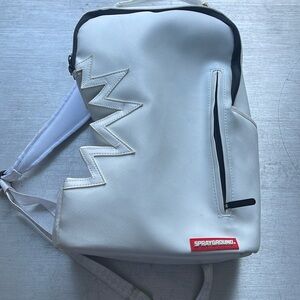 Used SprayGround White Shark bite Backpack.